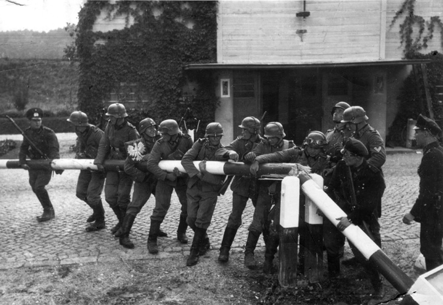 Staged photograph from 14 September 1939 for the purposes of German propaganda. Free City of Danzig police and custom officials reenact the removal of the Polish border crossing (1.9.1939 Sopot).